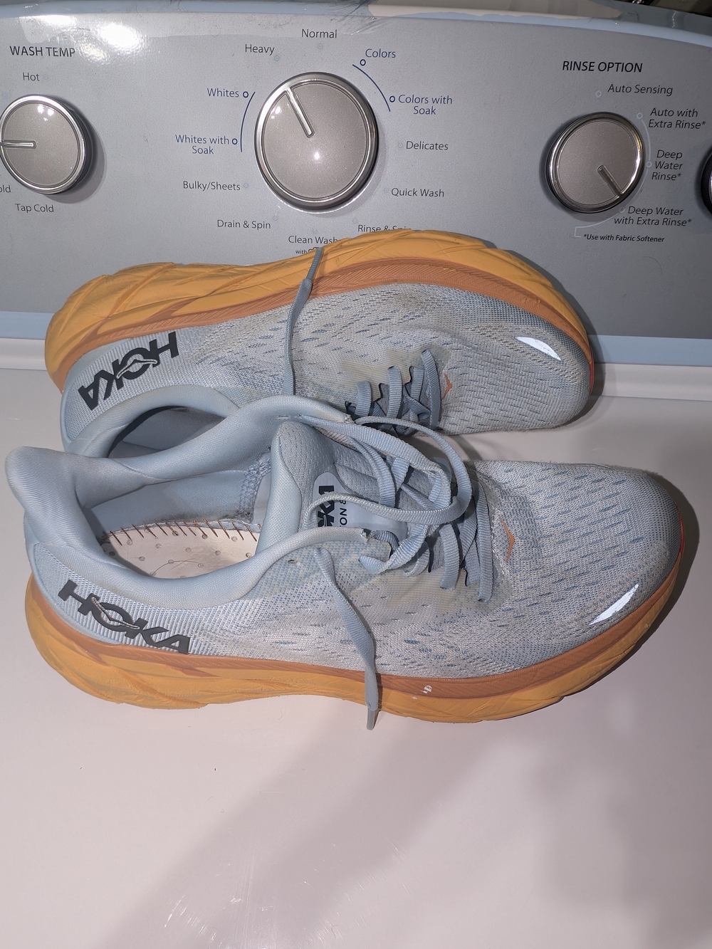 Hoka Women's Light Blue Running Shoes with Orange Sole